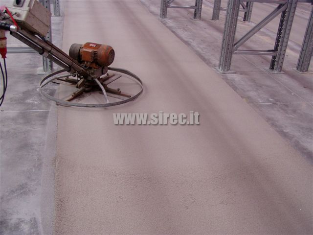 smoothing - compacting epoxy screed after correcting of flatness